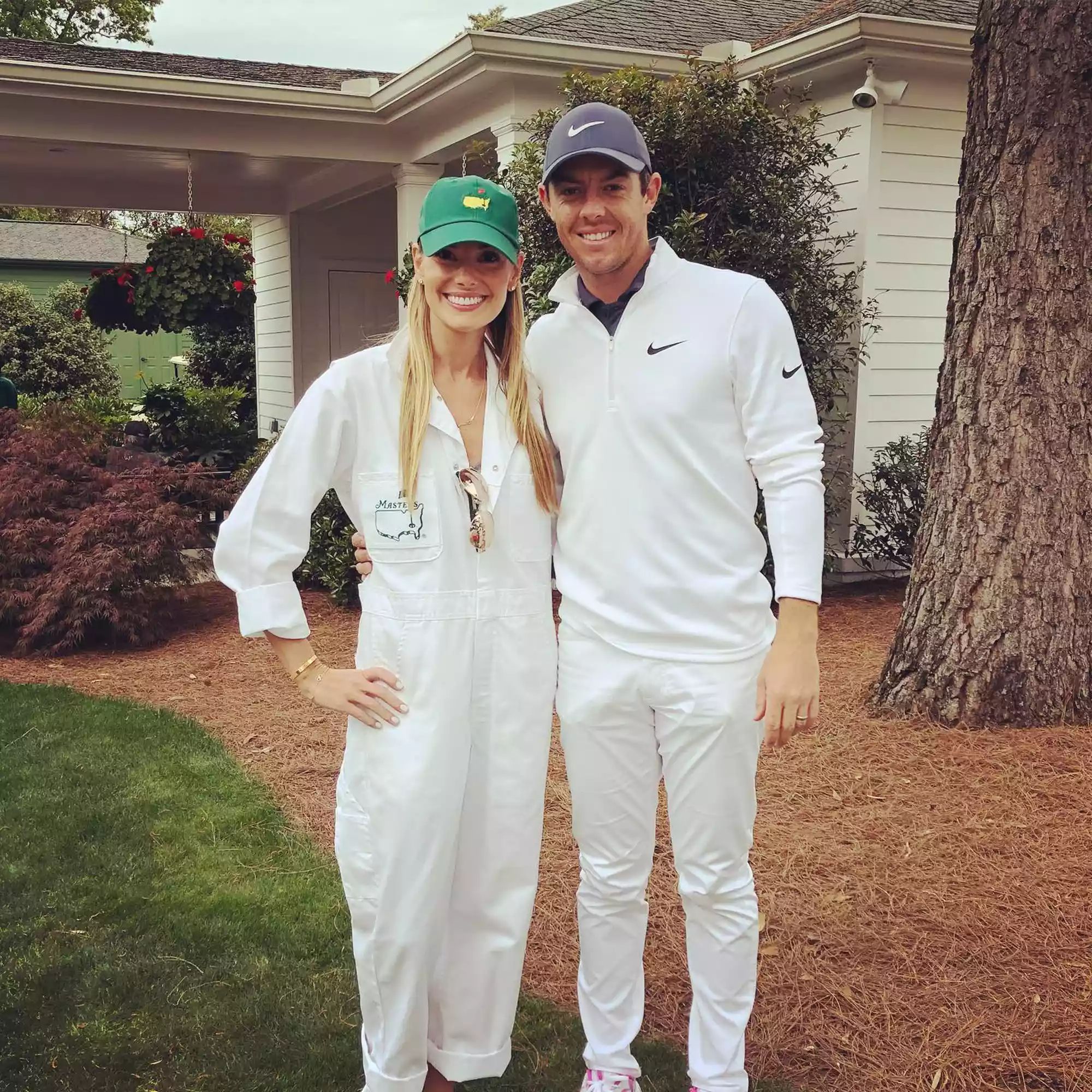 rory mcilroy and his wife with their daughter at their home garden.